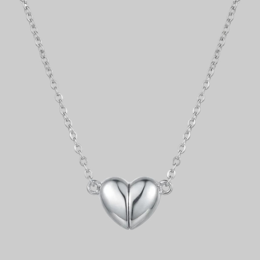 Silver heart-shaped pendant necklace on a white background