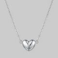Silver heart-shaped pendant necklace on a white background